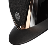 Charles Owen Hyda Sparkly riding hat in Black Gloss/Rose Gold, angled close-up of the sparkly top, crown badge and peak