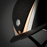 Charles Owen Hyda Sparkly riding hat in Black Gloss/Rose Gold, close-up of the crown and peak on a dark background