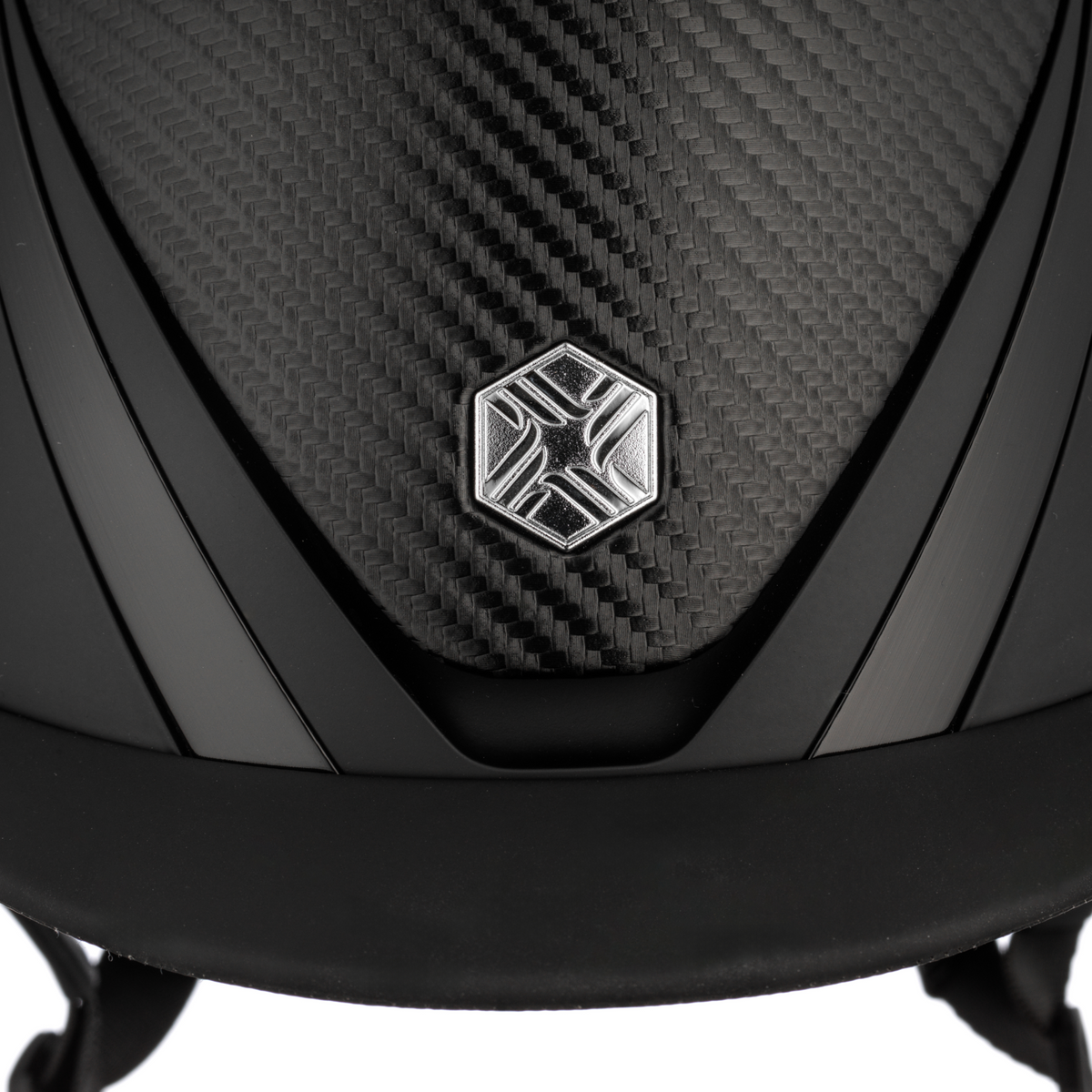 Charles Owen Hyda Carbon riding hat in Black Matte/Black Gloss, close-up of the carbon-effect top and crown badge